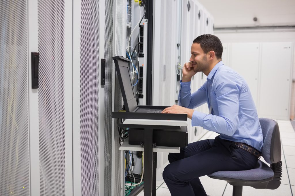 engineer maintaining server in data center