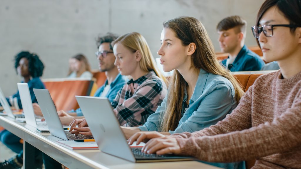 students on laptops in a lecture