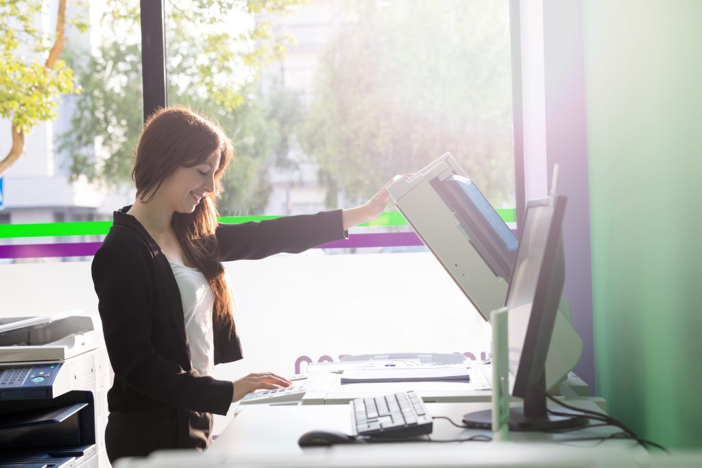 female university student using a printer