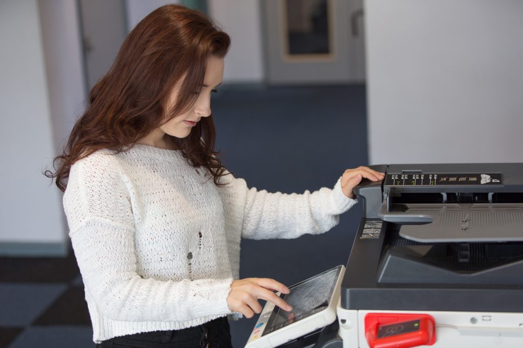 female college student using printer